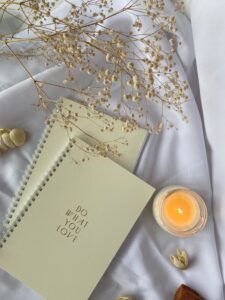 Two notebooks and candle